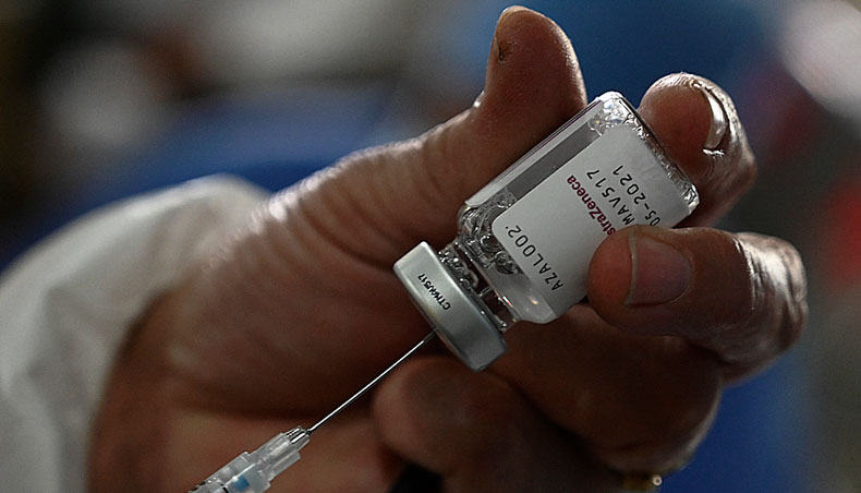 A nurse prepares an AstraZeneca vaccine against COVID-19 at the Alonso Suazo healthcare centre in Tegucigalpa, on March 15, 2021. — AFP photo