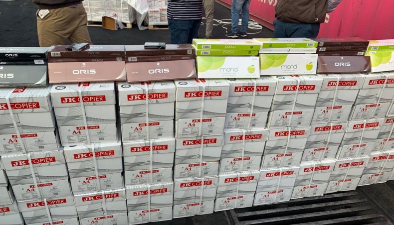 Custom authorities seize cigarettes hidden in a fancy way in a consignment of 'A4' size paper.- New Age photo