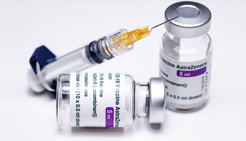 A file photo taken on March 11 shows vials of the AstraZeneca COVID-19 vaccine and a syringe in Paris. — Agence France-Presse/Joel Saget