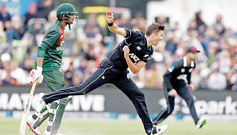 New Zealand pacer Trent Boult bowls past Bangladesh batsman Mahmudullah (back) during their first ODI match at University Oval in Dunedin on Saturday. — AFP photo