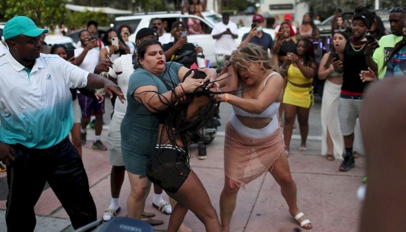 Women fight on the street near Ocean Drive on March 19, 2021 in Miami Beach, Florida. College students have arrived in the South Florida area for the annual spring break ritual. — AFP photo