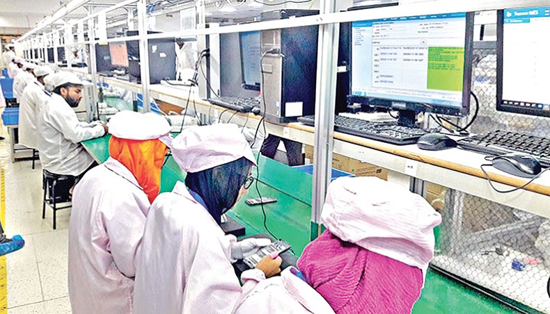 A file photo shows employees working at a mobile handset assembling factory at Ashulia, on the outskirts of Dhaka. The Bangladesh Mobile Phone Industry Association on Sunday demanded an extension of value-added tax exemption facility for mobile phone manufacturers two more years to June 2023 to facilitate the sector meeting fully demand for mobile phone devices in the country. — New Age photo