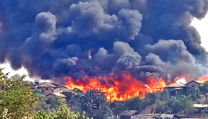 Plumes of smoke rise from the burning houses as a fire sweeps through the Balukhali Rohingya camp in Ukhiya upazila of Cox’s Bazar on Monday. — unhcr photo