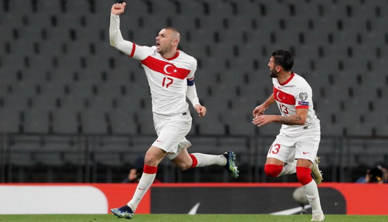 Turkey forward Burak Yilmaz (L) celebrates with defender Umut Meras after scoring his team's fourth goal during their 2022 FIFA World Cup qualifying match against Netherlands at the Ataturk Olympic Stadium in Istanbul on Wednesday. — AFP photo