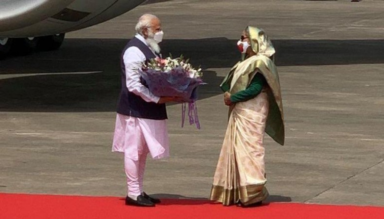 Prime minister Sheikh Hasina welcomes Indian prime minister Narendra Modi at Hazrat Shahjalal International Airport in Dhaka on Friday morning. -- PMO India tweet