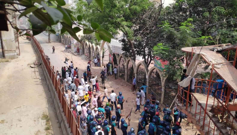 Anti-Modi protesters and police take position in Baitul Mukarrom National Mosque area in Dhaka after jumma prayers on Friday. -- New Age photo