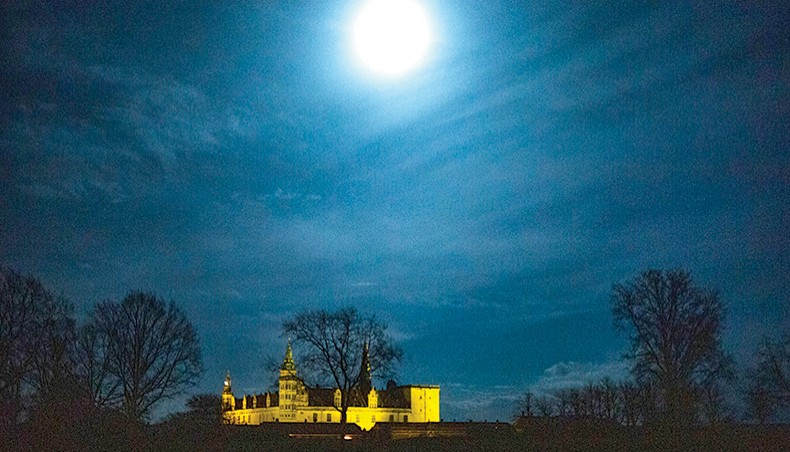 This picture shows the illuminated Kronborg Castle before the light was turned off to mark the Earth Hour Day, in Elsinore, Denmark, on Sunday. — AFP photo