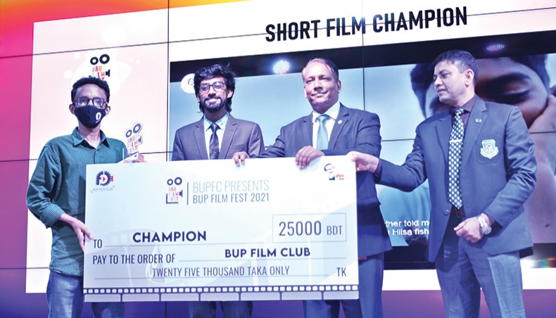 BUP officers distribute awards among the participants of a film festival organised by the university’s mass communication and journalism department on the campus in Dhaka on Thursday. — Press release