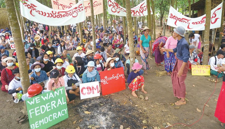 Protesters gathering in a village during a demonstration against the military coup in Dooplaya district in Myanmar’s eastern Karen state on Friday. — AFP photo
