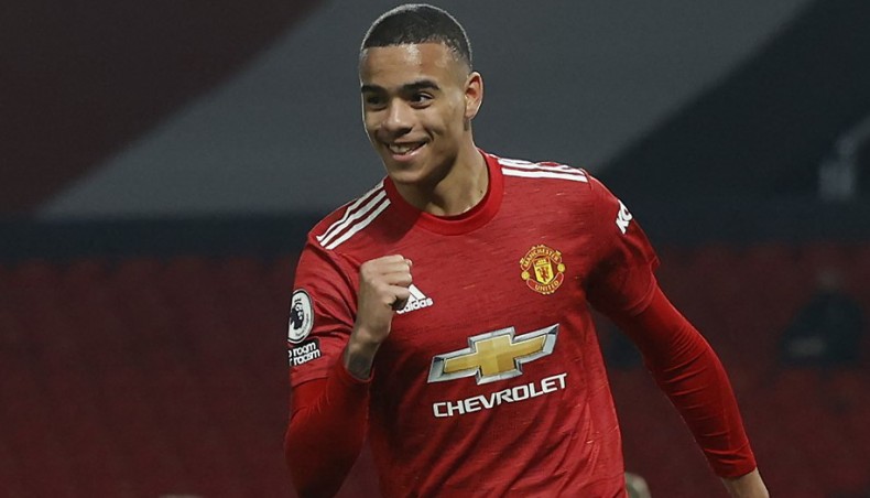 Manchester United striker Mason Greenwood celebrates after scoring his team's second goal during their Premier League match against and Brighton and Hove Albion at Old Trafford on Sunday. — AFP photo