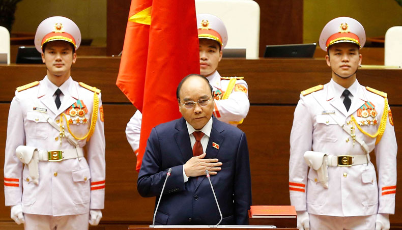 This picture taken and released by the Vietnam News Agency on April 5, 2021 shows former prime minister and Vietnam’s newly elected president Nguyen Xuan Phuc taking oath during the National Assembly’s spring session in Hanoi. — AFP photo