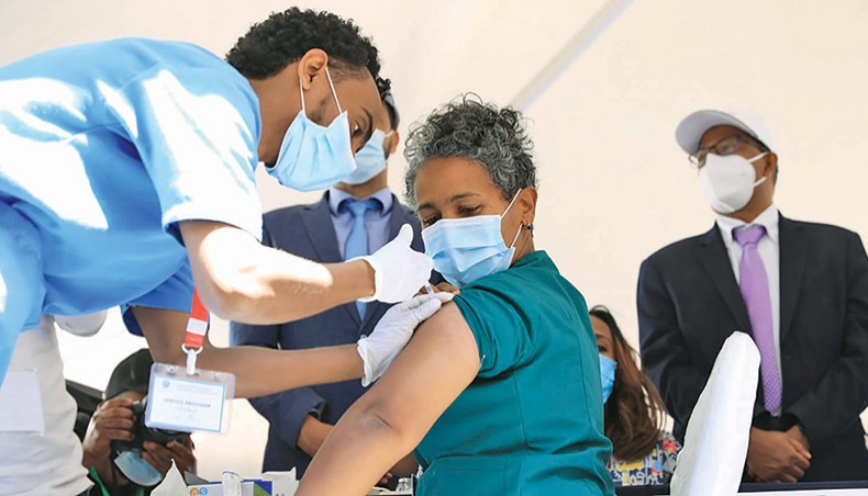 Health workers get vaccinated via the COVAX programme in Addis Ababa, Ethiopia on March 13. — Consortium News/Flickr/UNICEF Ethiopia