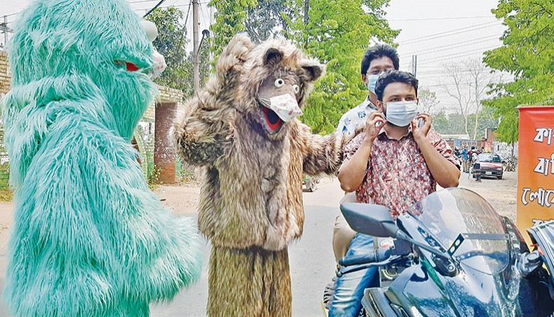 Jahangirnagar University students in muppet costumes make people aware about the importance of wearing masks to prevent the spread of COVID-19. — New Age photo