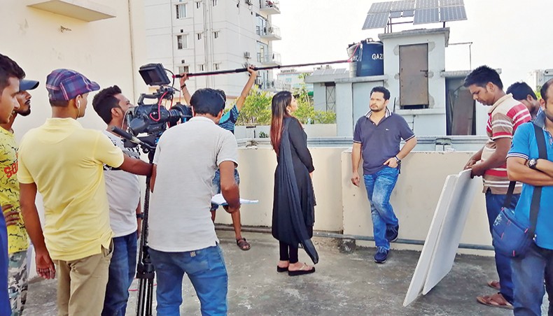 File photo shows artistes and crew members during shooting for a teleplay. — New Age photo