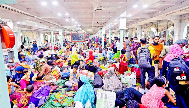 People cram on a ferry to travel back to their homes in Dhaka on April 4 the day before the government imposed lockdown as a preventive measure against the COVID-19 infection. — Agence France-Presse/Munir Uz Zaman