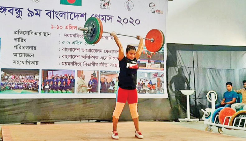 Bangladesh Ansar weightlifter Mabia Akter in action during women’s 64kg weight category event of the 9th Bangabandhu Bangladesh Games on Wednesday.— BOA photo