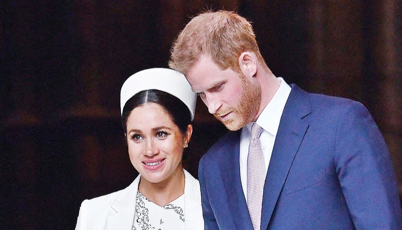 Meghan Markle with Prince Harry. — AFP photo
