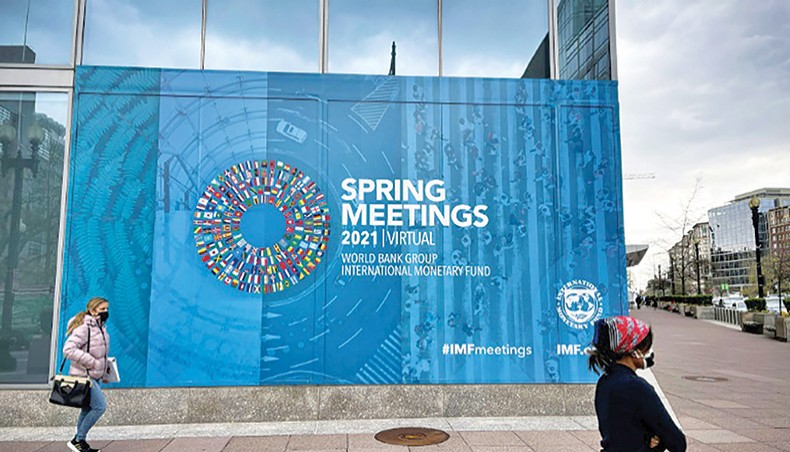 A photo shows a banner of the Spring Meetings 2021 of the International Monetary Fund. The IMF and United States on Wednesday gave a boost to the international campaign to raise taxes on wealthy firms that have done well during the pandemic in order to finance recovery efforts. — AFP photo