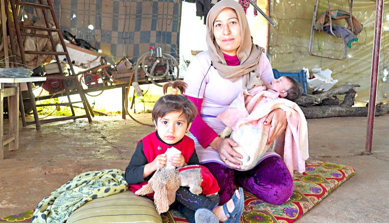 A family in Syria receive food assistance from the World Food Programme. — World Food Programme/Hussam Al Saleh