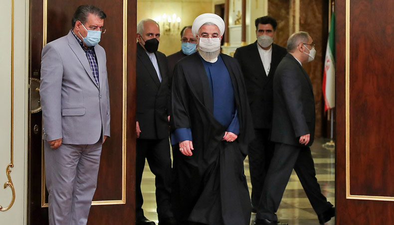 A hand-out picture provided by the Iranian presidency on April 13, 2021 shows Iranian president Hassan Rouhani and foreign minister Mohammad Javad Zarif arriving for a meeting with the Russian foreign minister in the capital Tehran. — AFP photo