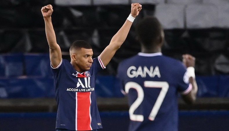 Paris Saint-Germain forward Kylian Mbappe (L) and midfielder Idrissa Gueye celebrate after winning their UEFA Champions League quarter-final second leg match against Bayern Munich at the Parc des Princes stadium in Paris on Tuesday. — AFP photo