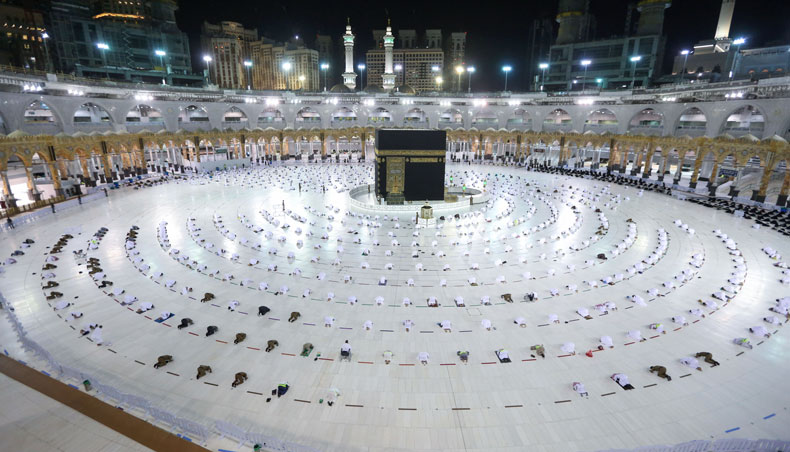 Muslim worshippers perform the evening Tarawih prayer during the fasting month of Ramadan around the Kaaba in the Grand Mosque complex in the holy city of Mecca, on April 13, 2021. — AFP photo