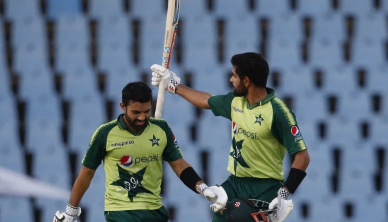 Pakistan captain Babar Azam (R) celebrates his century against South Africa during their third Twenty20 international match at SuperSport Park in Centurion on Wednesday. — AFP photo