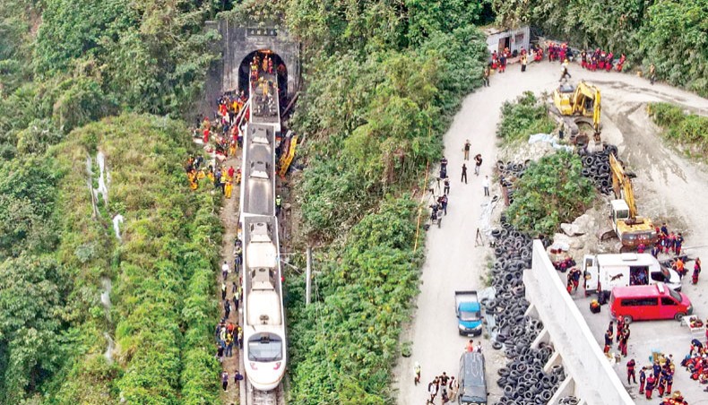 An aerial view shows rescue workers at the site where a train derailed inside a tunnel in the mountains of Hualien, eastern Taiwan on April 2, 2021. — AFP photo