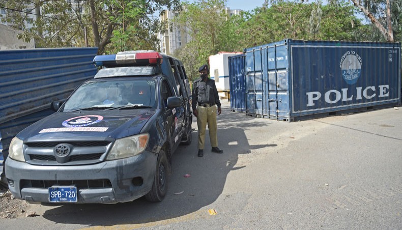 The police stand guard near the French Consulate building to beef up security following a protest by extremist political party Tehreek-e-Labbaik Pakistan, in Karachi on April 15, 2021. — AFP Photo