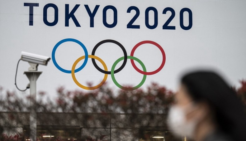 A Tokyo 2020 Olympics Games banner is displayed on the wall of the Tokyo Metropolitan Government building in Tokyo on April 13, 2021.-- AFP photo