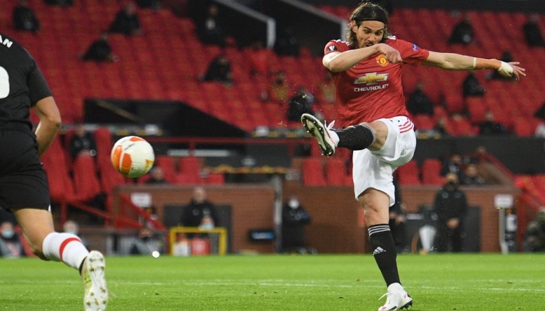 Manchester United striker Edinson Cavani shoots to score his team’s opening goal against Granada during their UEFA Europa league quarter-final second leg match at Old Trafford stadium in Manchester on Thursday. — AFP photo