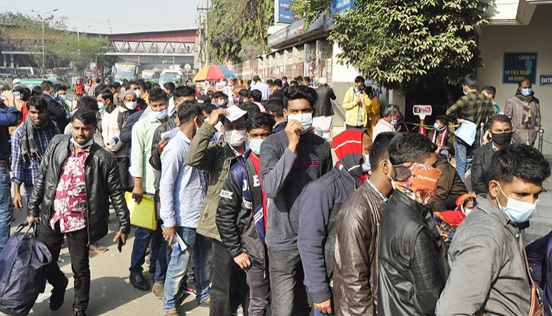 People intending to go abroad wait in a queue for COVID-19 testing in front of a test centre at Mohakhali in Dhaka on Saturday, December 20, 2020. — Focus Bangla photo