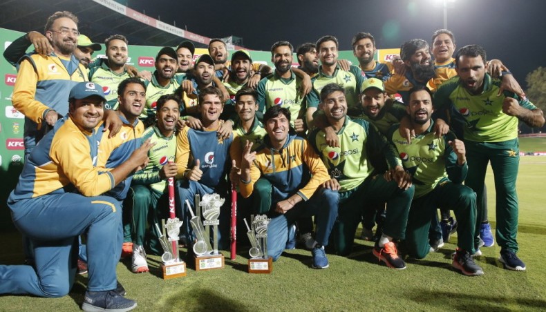 Pakistan players and support staff celebrate their series victory after the fourth Twenty20 international match against South Africa at SuperSport Park in Centurion on Friday. — AFP photo