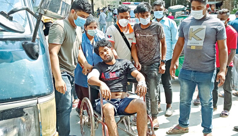 An injured man rests on a wheelchair after being treated at a hospital in Chittagong on Saturday following a protest by demonstrating workers at the construction site of a Chinese-financed power plant. — AFP photo
