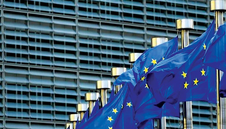 European Union flags are seen in front of the European Commission building in Brussels. The European Commission will next week present the first part of a ‘green taxonomy’ list of energy sources and technology to be labelled as sustainable investments, but a question mark hangs over the inclusion of natural gas. — AFP photo