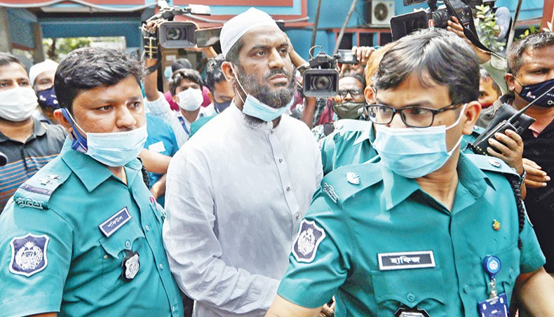 Police take Hefazat-e-Islam leader Mamunul Haque to Tejgaon police station from a madrassah at Mohammadpur in Dhaka for interrogation on Sunday. — New Age photo