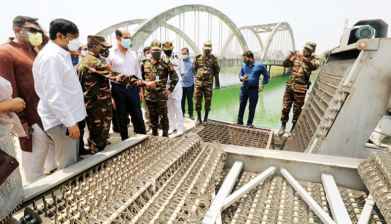 Dhaka North city mayor Md Atiqul Islam inspects the operation of an automatic drain cleaner in the Hatirjheel area of Dhaka on Monday. — DNCC photo