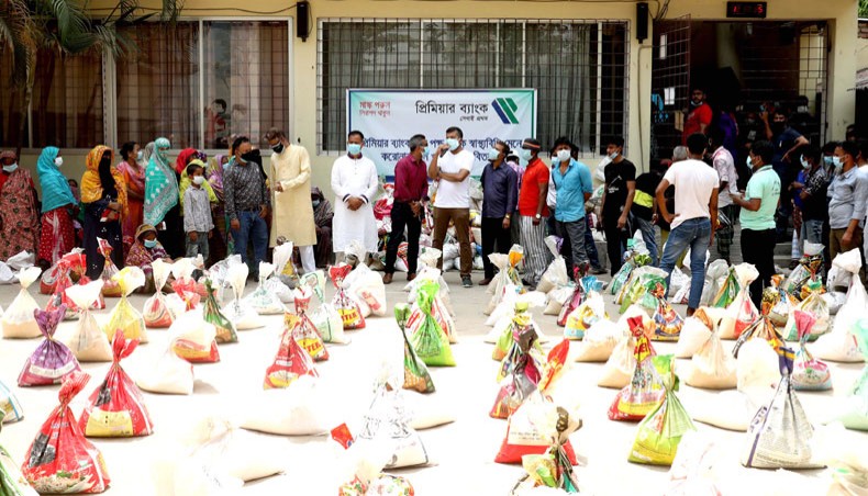 Premier Bank Limited starts distributing food supplies among the extreme poor, destitute, vagabonds and street children at various locations across Bangladesh on Tuesday. — Press Release