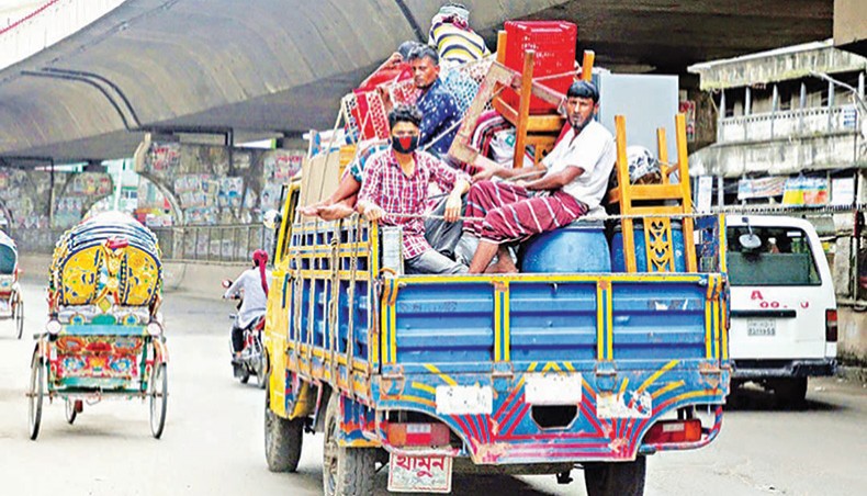 A file photo shows people leaving the capital with their belongings on a truck due to income losses amid the coronavirus outbreak in the country. Thousands of workers across the country are now struggling to maintain their family as they have been without work after restrictions were imposed on public movement and the operation of markets and many commercial ventures on April 5 to contain the spread of Covid-19. — New Age photo