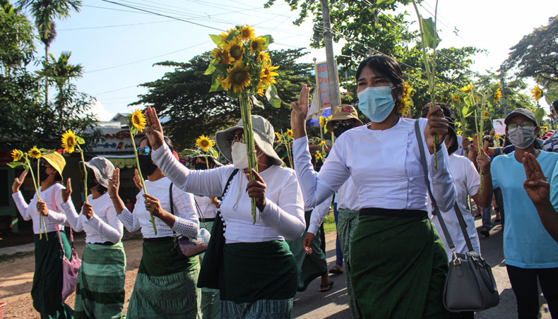 This hand-out photo taken and released by Dawei Watch on April 21, 2021 shows protesters holding sunflowers during a demonstration against the military coup in Dawei. — AFP photo