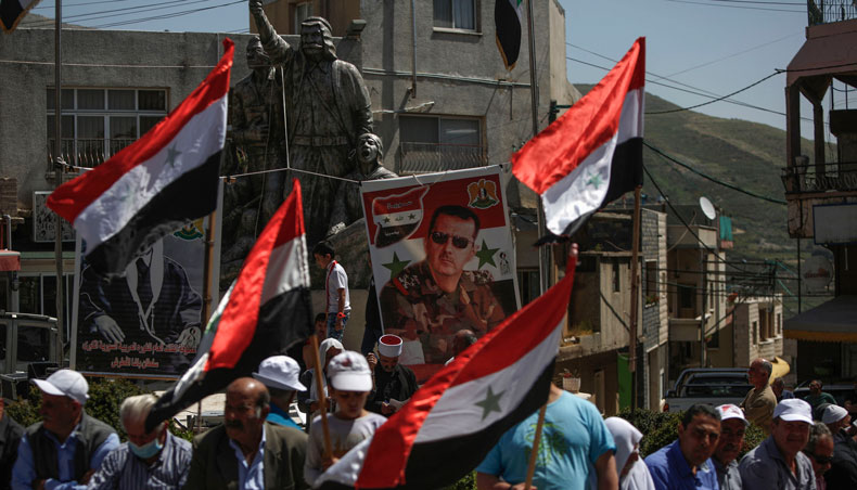Druze residents of the Israeli-annexed Golan Heights gather during a rally in the village of Majdal Shams to mark Syria’s Independence Day, on April 17, 2021. — AFP photo