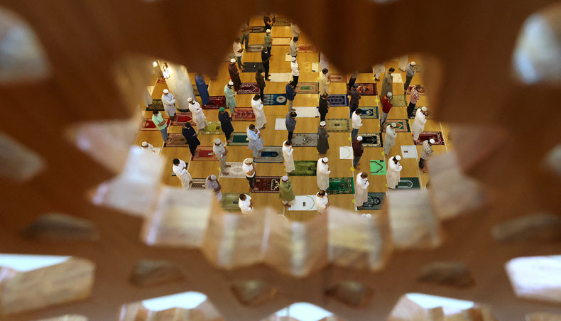 Muslim devotees, wearing protective masks amid the COVID-19 pandemic, pray on the first Friday of the holy fasting month of Ramadan at a mosque in Dubai on April 16, 2021. — AFP photo