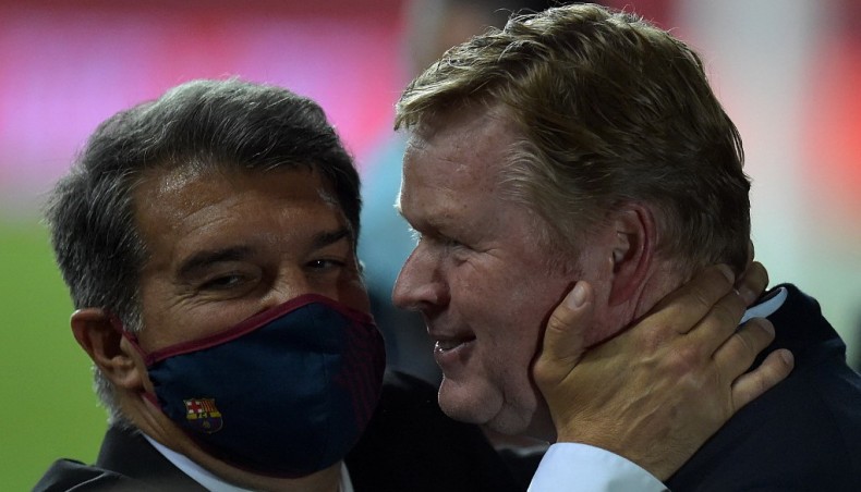 Barcelona coach Ronald Koeman (R) celebrates with club president Joan Laporta at the end of their Copa del Rey final against Athletic Bilbao at the La Cartuja stadium in Seville on April 17, 2021.— AFP photo