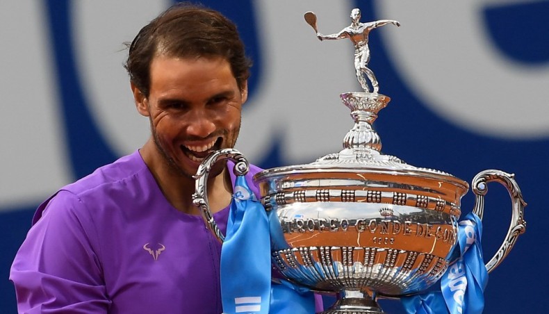 Spain's Rafael Nadal celebrates with the trophy after winning the ATP Barcelona Open tennis tournament singles final against Greece's Stefanos Tsitsipas at the Real Club de Tenis in Barcelona on Saturday. — AFP photo