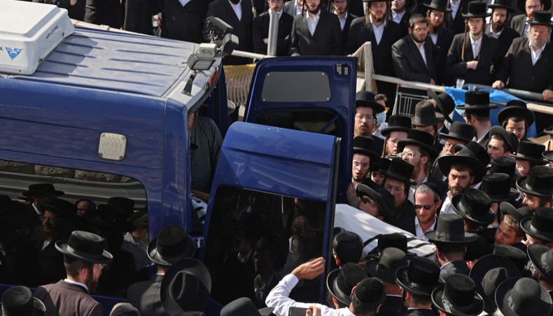 Ultra-Orthodox Jewish men take part in a funeral ceremony in Jerusalem for a victim of an overnight stampede during a religious gathering in northern Israel, on April 30, 2021. — AFP Photo