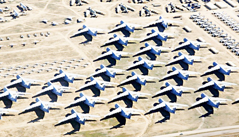 Surplus US military planes are stored in the largest airplane boneyard in the world at Davis-Monthan Air Force Base in Tucson, Arizona. — Common Dreams/Getty
