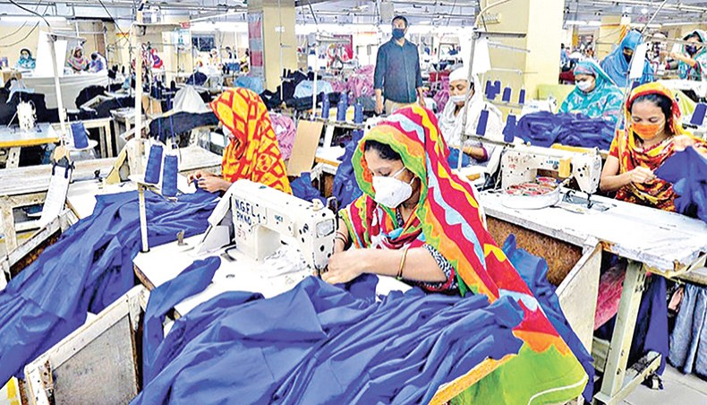 A file photo shows labourers wearing facemasks working at a garment factory in Dhaka recently. The country’s export earnings in the July-April period of the current financial year 2020-21 grew by 8.74 per cent to $32.07 billion from $29.49 billion in the same period of the previous fiscal year riding on moderate performance of readymade garments. — AFP photo