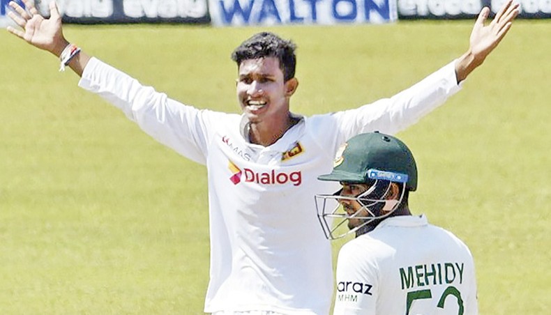 Sri Lankan spinner Praveen Jayawickrama celebrates the wicket of Bangladesh batsman Liton Das (not in picture) on the fifth day of their second and final Test at the Pallekele International Cricket Stadium in Kandy on Monday. — AFP photo