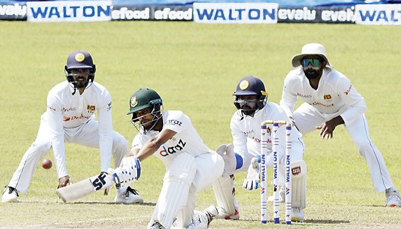 Bangladesh all-rounder Mehidy Hasan plays a shot on the fifth and final day of their second Test against Sri Lanka at the Pellekele International Cricket Stadium in Kandy on Monday. — AFP photo