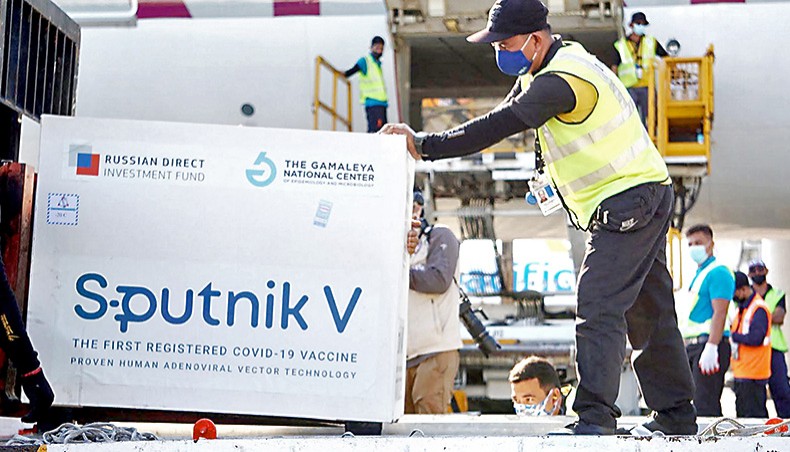 The Russian-made Sputnik V vaccine is unloaded from a plane shortly after arriving at the international airport in Manila. — Agence Frnace-Prese